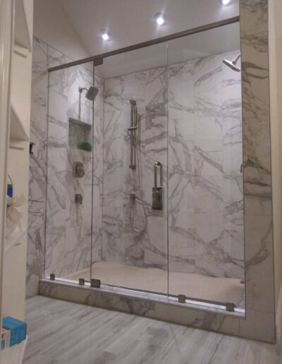 Marble Tiles Shower With Semi Frameless Shower Door