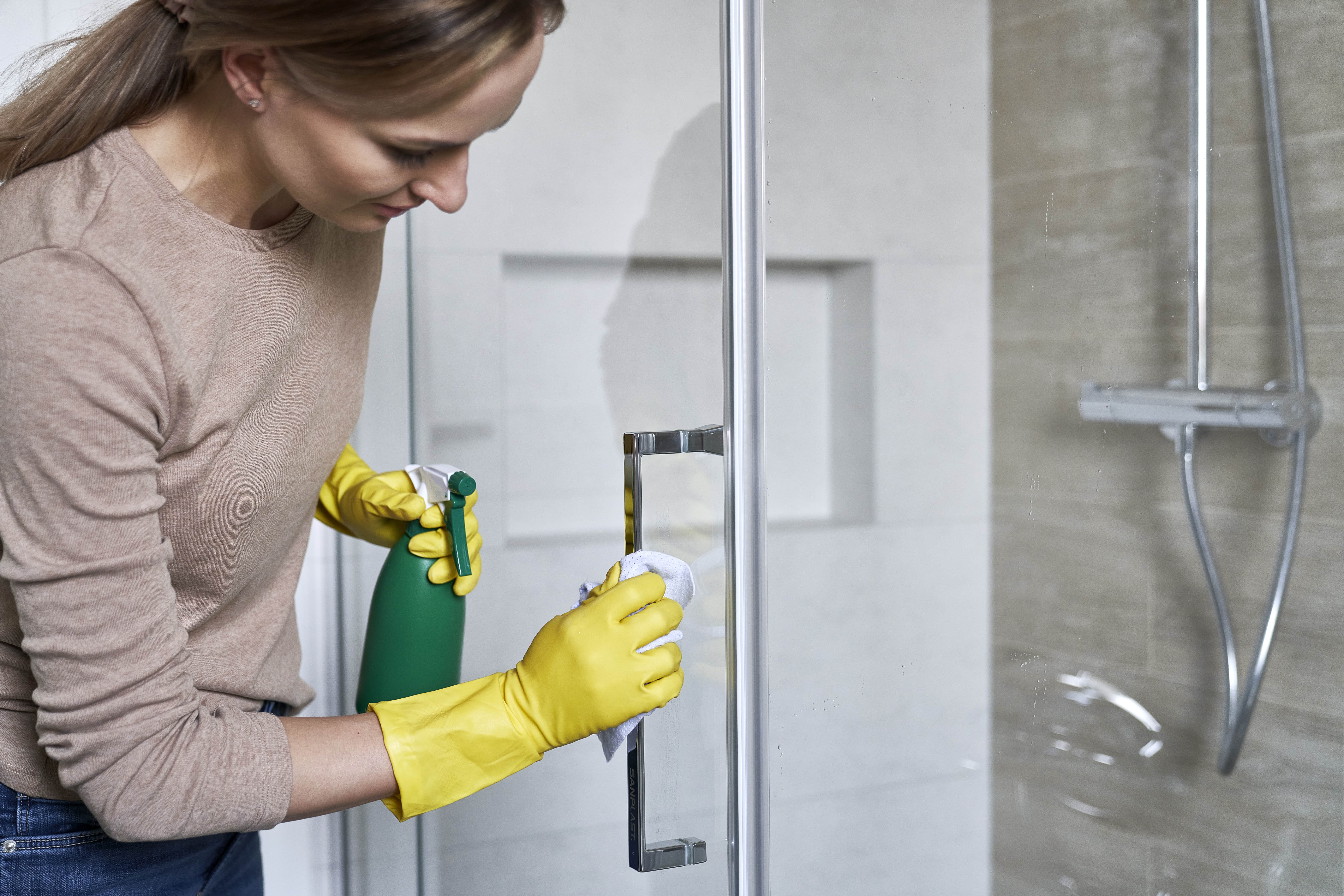 The Woman Cleaning The Glass Shower Doors In Plano Tx